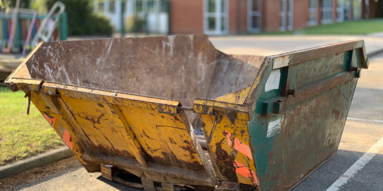 skip outside a house